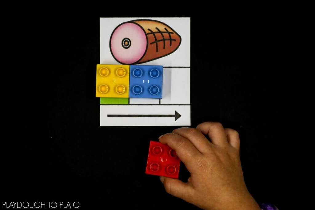 Slide in a LEGO brick as kids say each phoneme.